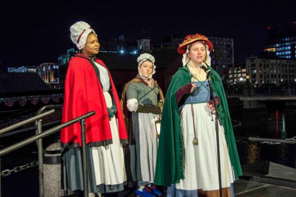 Several actresses play the part of narrators during the dumping of the tea in the harbor. (Alan Wakim/Sons of History)
