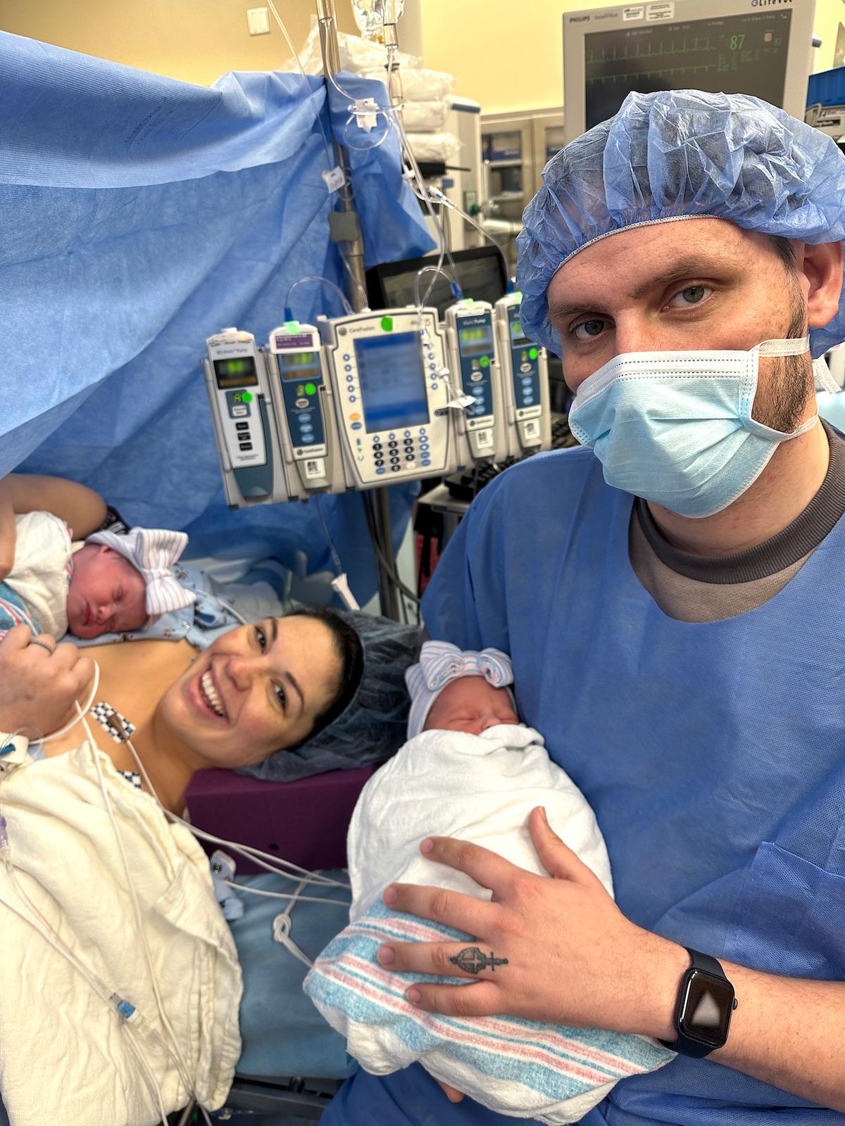 After the C-section, Mrs. Hatcher holds Rebel while her husband holds Roxi. (Courtesy of UAB)