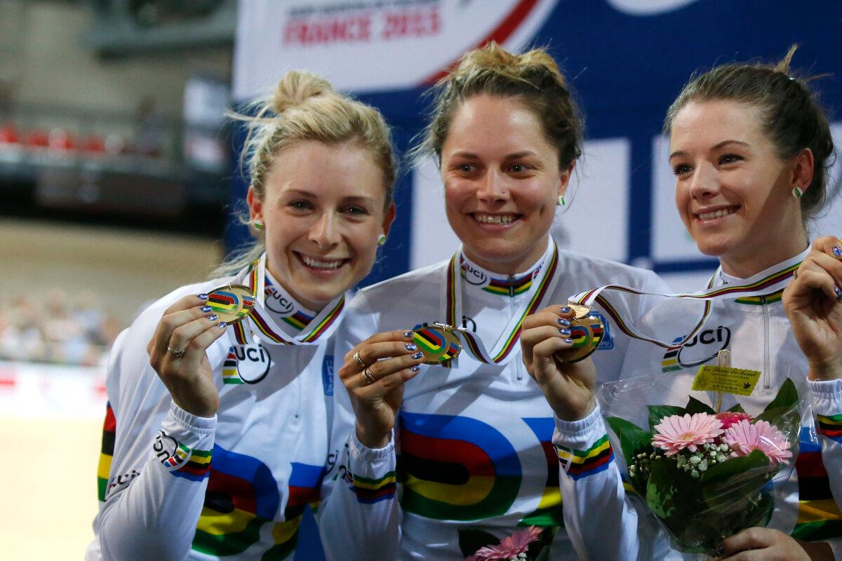 (L-R) The Australian team Melissa Hoskins, Amy Cure, Ashlee Ankudinoff and Annette Emonodson (not pictured) pose with their gold medal celebrates during the Women's Team Pursuit race medal ceremony at the Track Cycling World Championships in Saint-Quentin-en-Yvelines, outside Paris on Feb. 19, 2015. (Michel Euler/AP Photo)