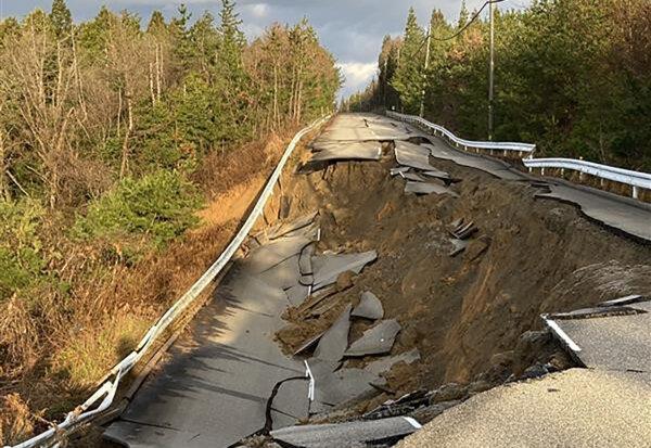 This image shows a collapsed road near the city of Shika, Ishikawa prefecture, Japan, on Jan. 2, 2024. (Jiji Press/AFP via Getty Images)