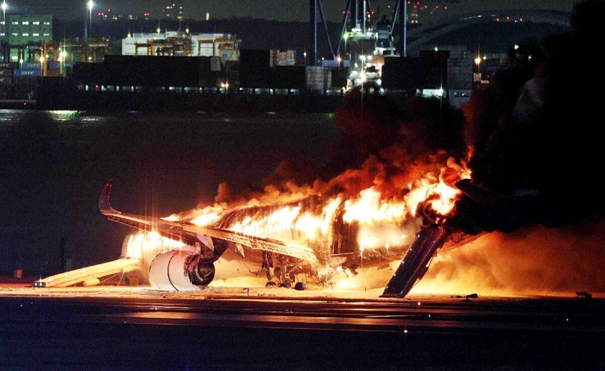  A Japan Airlines plane on fire on a runway of Tokyo’s Haneda Airport, on Jan. 2, 2024. (Jiji Press/AFP via Getty Images)