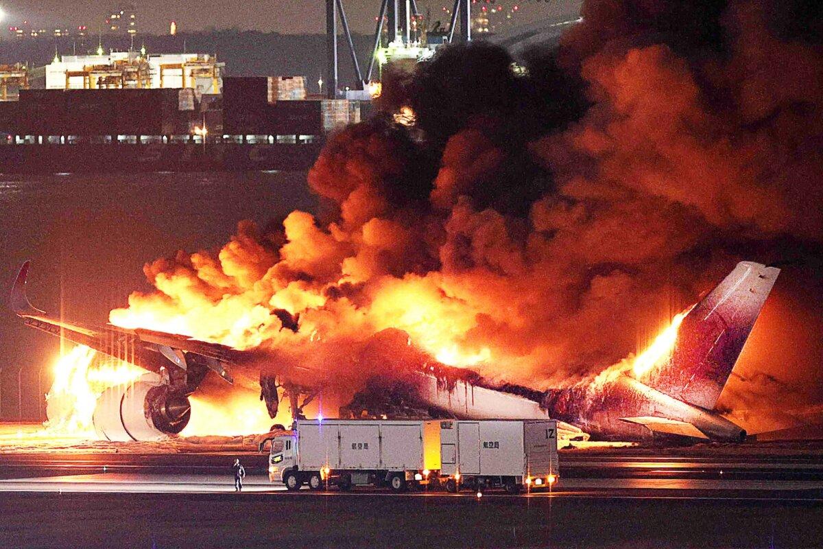 Airliner With 379 Passengers Erupts in Flames After Crashing Into Coast Guard Plane in Tokyo | USNN World News  A Japan Airlines plane on fire on a runway of Tokyo’s Haneda Airport, on Jan. 2, 2024. (Jiji Press/AFP via Getty Images)