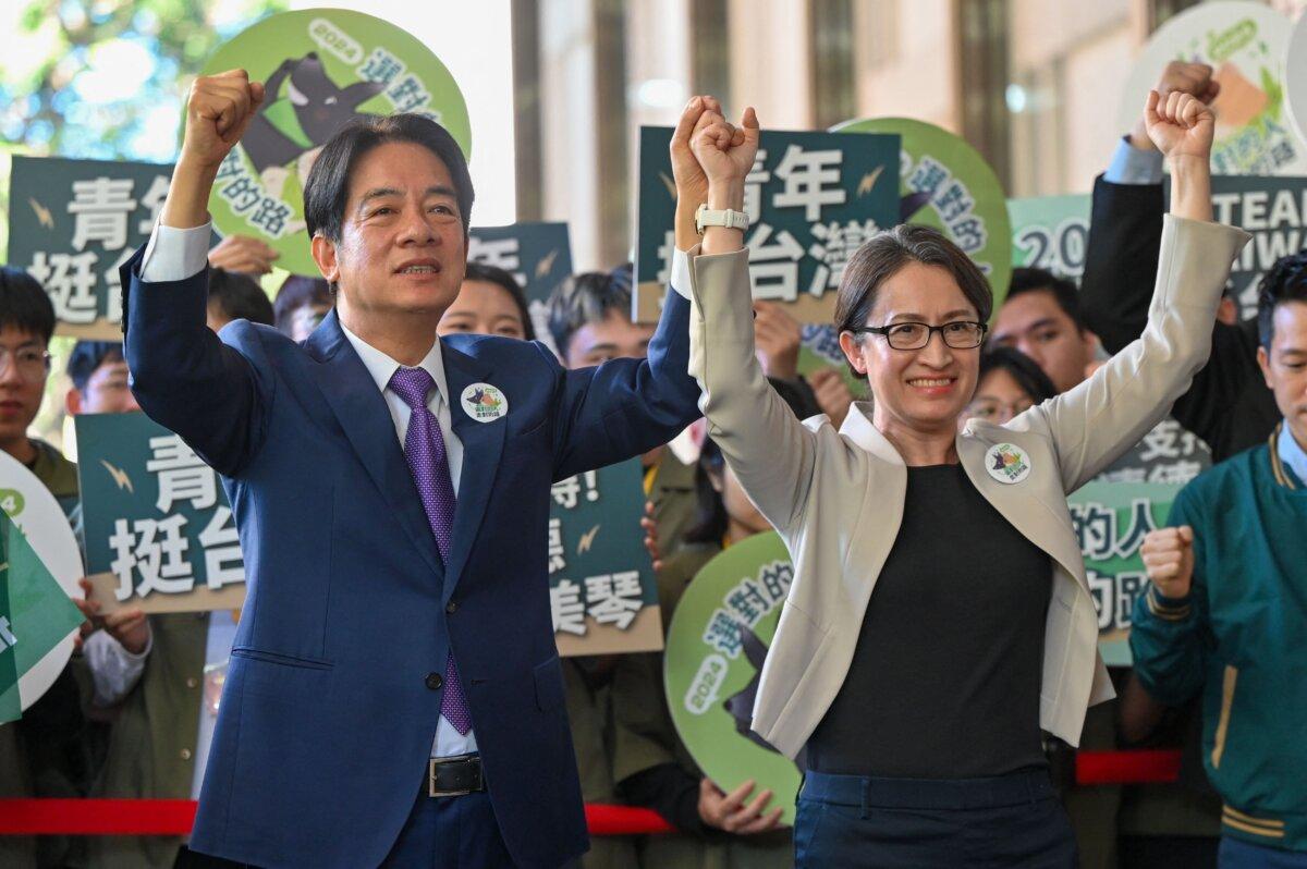 Taiwan presidential candidate Lai Ching-te (L) and running mate Hsiao Bi-khim (R), from the ruling Democratic Progressive Party (DPP), gesture in front of supporters after they registered to run in the 2024 presidential elections in Taipei, Taiwan, on Nov. 21, 2023. (Sam Yeh/AFP via Getty Images)