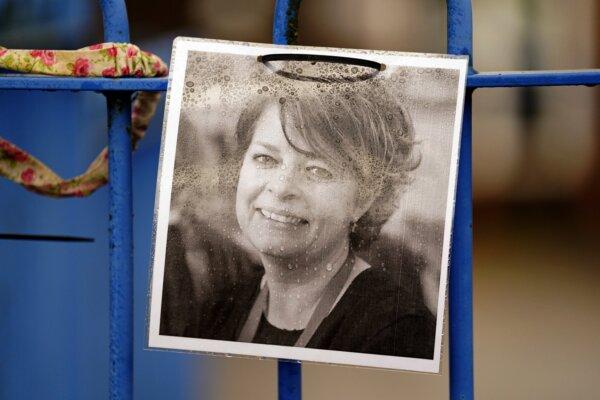 Photograph of Ruth Perry attached to the fence outside John Rankin Schools in Newbury, Berkshire, England on Dec. 7, 2023. (Andrew Matthews/PA Wire)