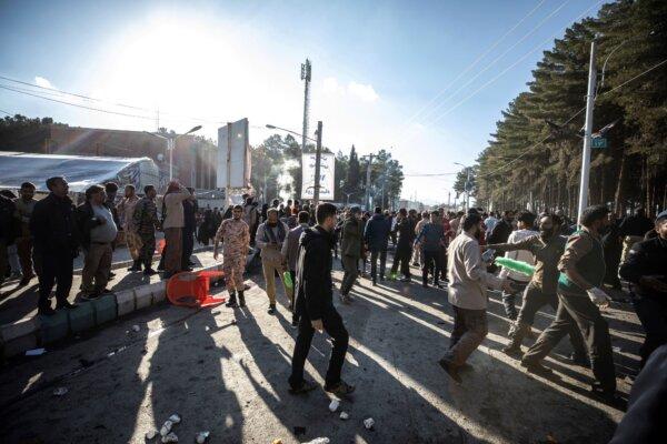 Bystanders react after an explosion in Kerman, Iran, on Jan. 3, 2024. (Mahdi Karbakhsh Ravari/AP Photo)