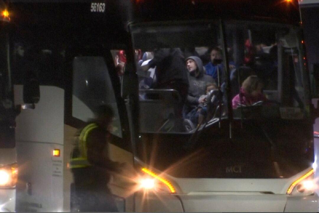 Suburbs Put the Brakes on Migrant Bus Arrivals After Crackdowns in Chicago and New York