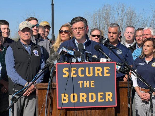 House Speaker Mike Johnson (R-La.) speaks while standing with Republican members of Congress in Eagle Pass, Texas, on Jan. 3, 2024. (Charlotte Cuthbertson/The Epoch Times)