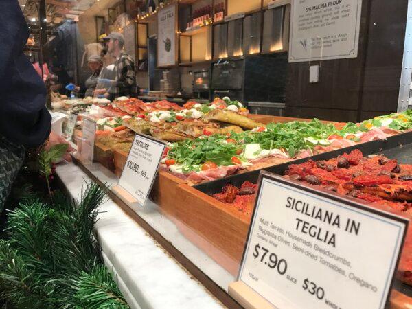 Pizza slices on display at Eataly’s quick service counter in San Jose, Calif., on Dec. 29, 2023. (Keegan Billings/The Epoch Times)