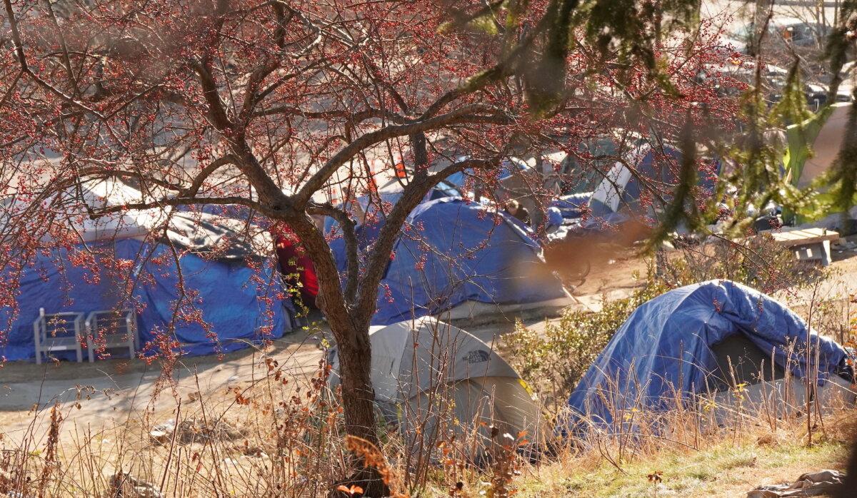 These tents were among an estimated 70 tents at the Harbor View Memorial Park encampment on Dec. 16, 2023 before the city removed the campsite on Jan. 2, 2024. (Allan Stein/The Epoch Times)