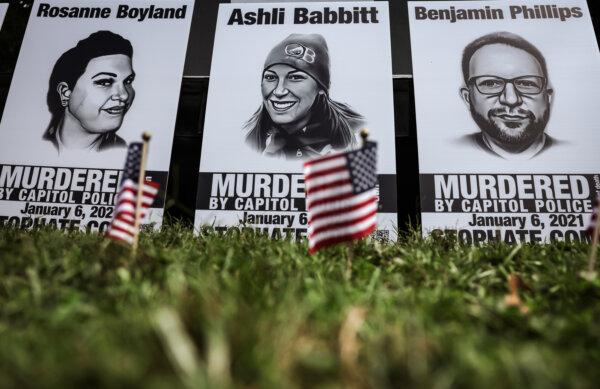 Pictures of Rosanne Boyland, Ashli Babbitt, and Benjamin Phillips, who died on Jan. 6, 2021, are seen during a rally near the Capitol, on Sept. 24, 2022. (Alex Wong/Getty Images)