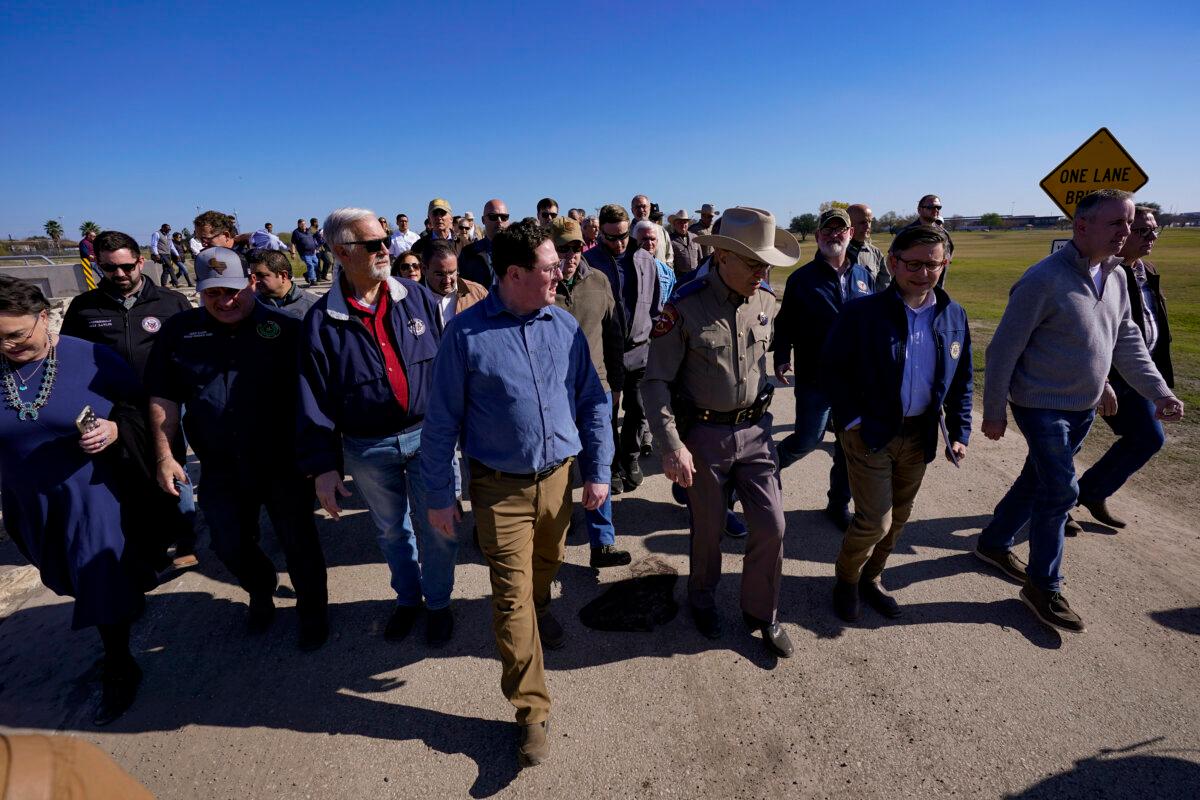Republican members of Congress walk adjacent to the Rio Grande at the Texas-Mexico border in Eagle Pass, Texas, on Jan. 3, 2024. (Eric Gay/AP Photo)