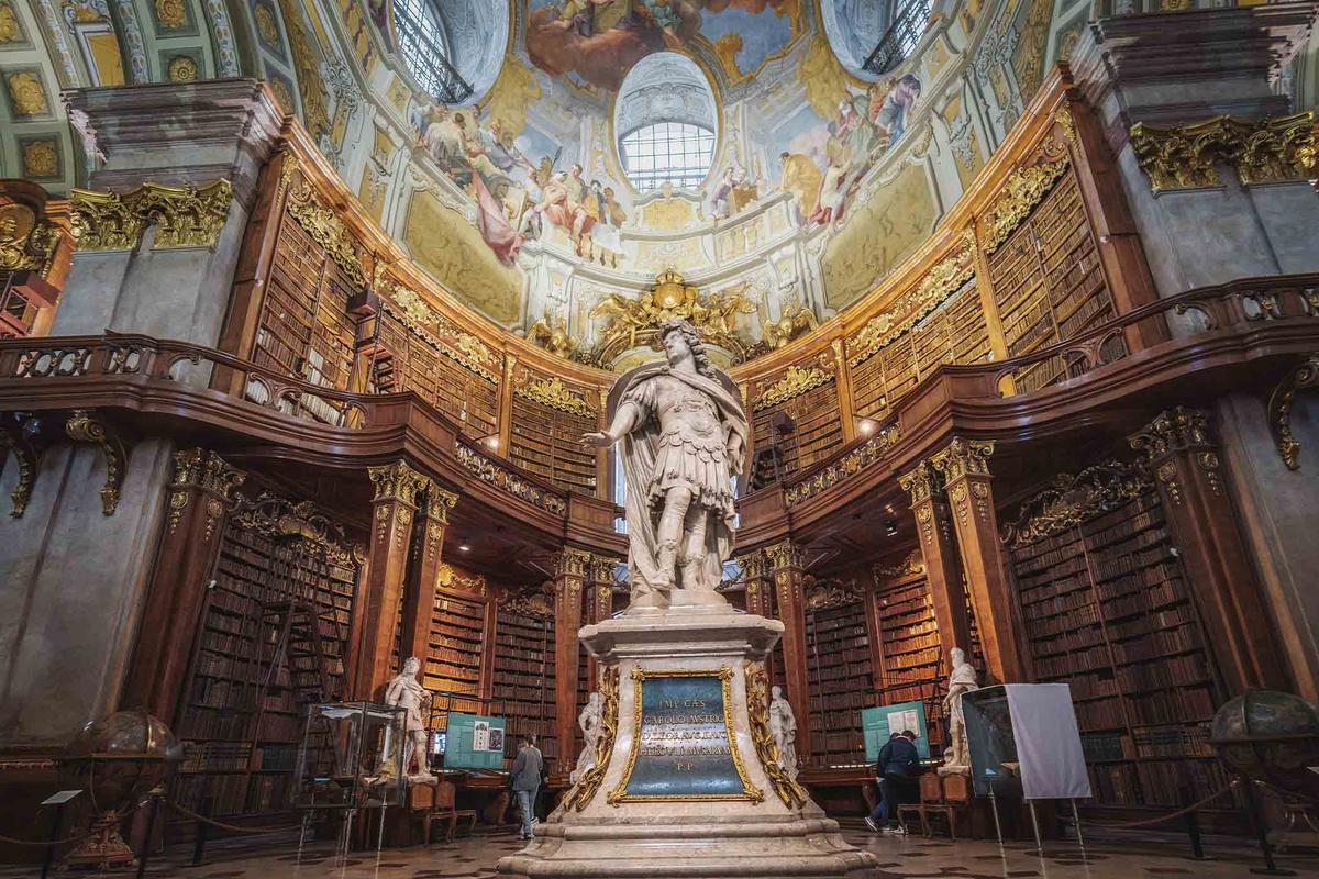 A statue of Emperor Charles VI inside the Austrian National Library's State Hall in Vienna, Austria.  (Diego Grandi/Shutterstock)
