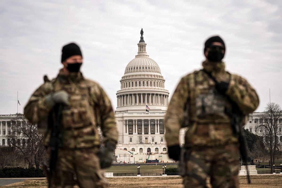 Members of the National Guard patrol the area outside of the U.S. Capitol during the impeachment trial of former president Donald Trump at the Capitol in Washington on Feb. 10, 2021. (Jose Luis Magana/AP Photo)
