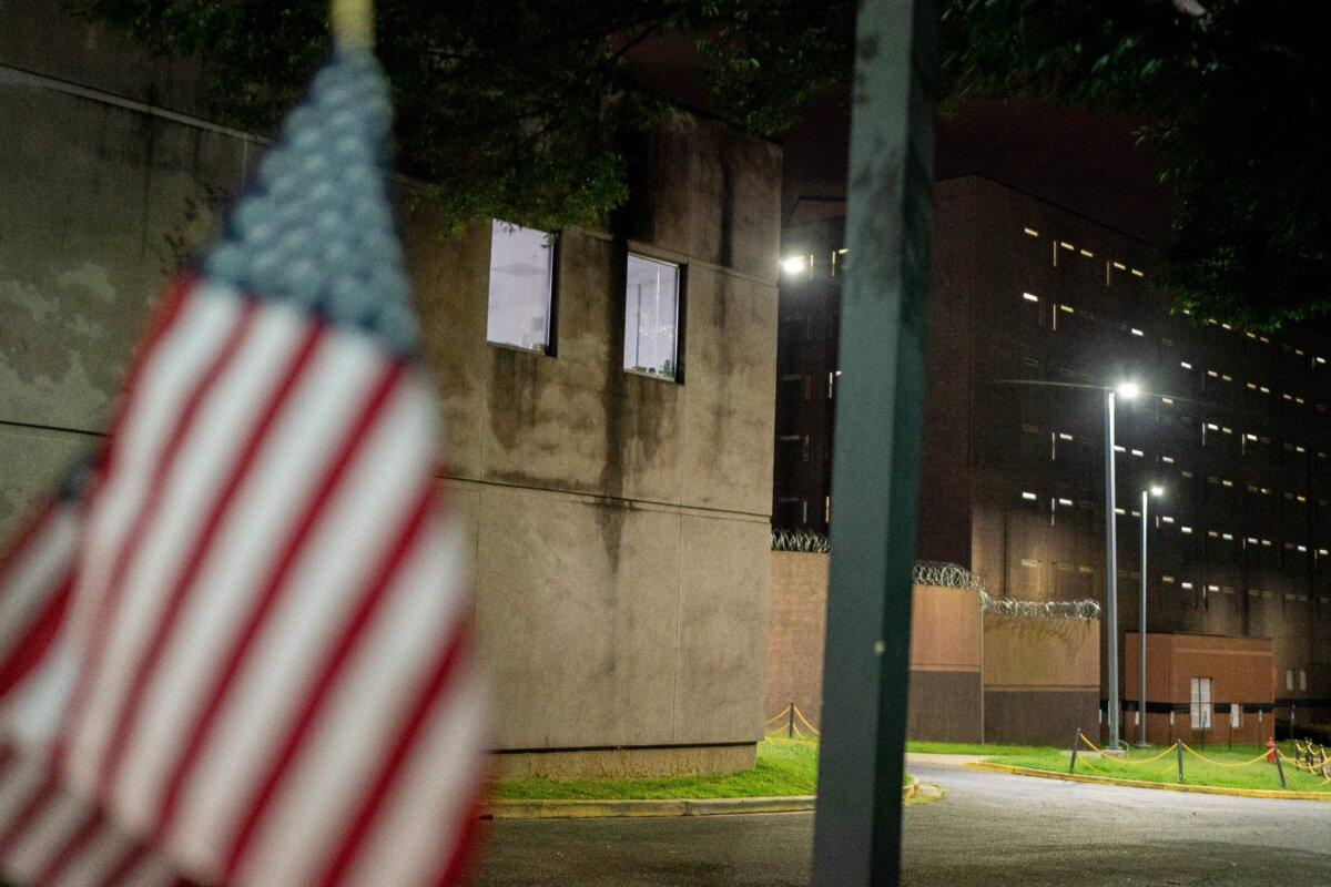 A U.S. flag is displayed in front of the DC Correctional Facility during a demonstration for the people who have been imprisoned for their participation in the Jan. 6 Capitol Breach in Washington, on Aug. 30, 2022. (Stefani Reynolds/AFP via Getty Images)