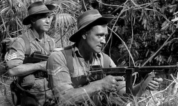 Sgt. Mitchem (Richard Todd, L) and his right-hand man Cpl. Johnstone (Richard Harris) in “Jungle Fighters.” (Productions ABPC)