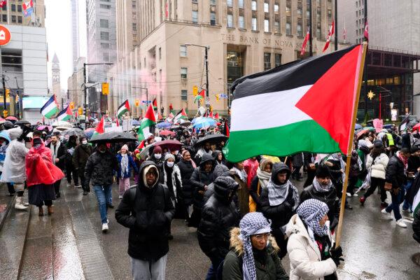 Amid the ongoing Israel-Hamas conflict, pro-Palestine protesters hold a rally in downtown Toronto on Dec. 23, 2023. (The Canadian Press/Christopher Katsarov)
