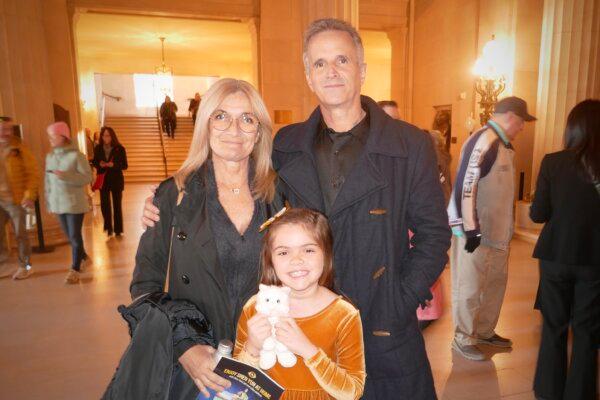 Magda and François Cavard, with their granddaughter, at Shen Yun Performing Arts in San Francisco on Jan. 7, 2024. (Steve Ispas/The Epoch Times)