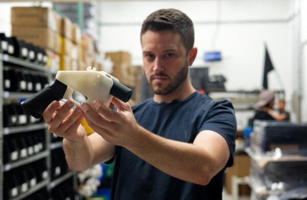 Cody Wilson, owner of Defense Distributed, holds a 3D printed gun called the "Liberator" at his factory in Austin, Texas, on Aug. 1, 2018. (Kelly West/AFP via Getty Images)