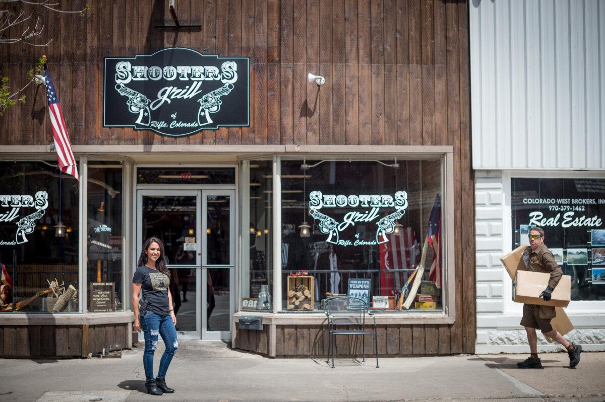 Lauren Boebert (L) poses for a portrait outside Shooters Grill in Rifle, Colorado, which she owned with her former husband Jayson, on April 24, 2018. (Emily Kask/AFP via Getty Images)
