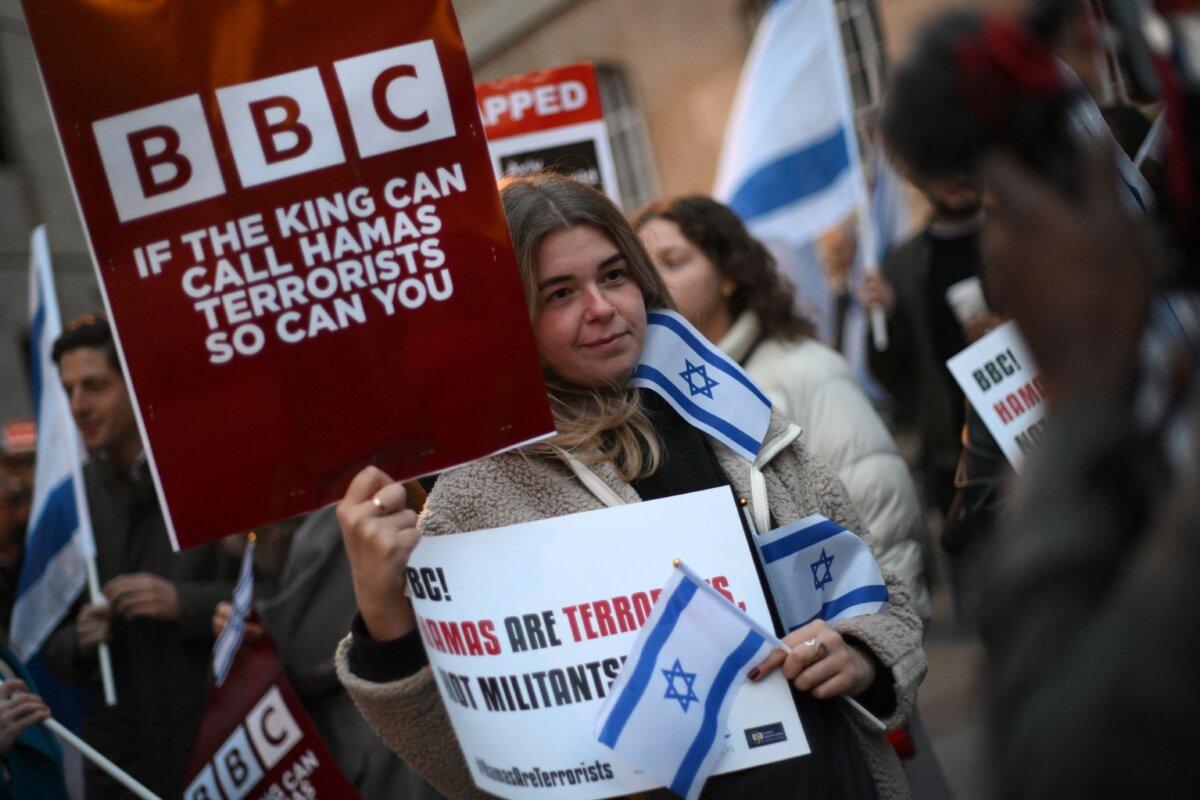 Protesters holding placards and Israeli flags join a gathering outside the headquarters of the BBC to appeal to the corporation to call Hamas “terrorists,” in London on Oct. 16, 2023. (Daniel Leal/AFP via Getty Images)