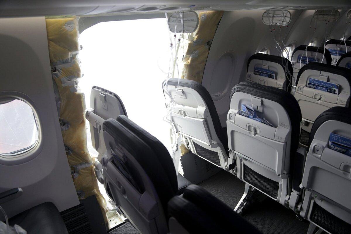 This photo released by the National Transportation Safety Board shows a gaping hole where the paneled-over door had been at the fuselage plug area of Alaska Airlines Flight 1282 in Portland, Ore. on Jan. 7, 2024. (The Canadian Press/AP-HO, National Transportation Safety Board)