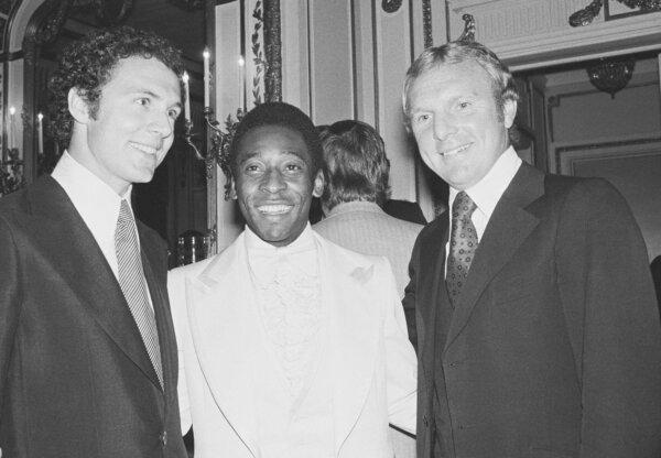 Captain of the 1974 World Cup team from West Germany, Franz Beckenbauer, (L), Soccer star Pele, (C), and Bobby Moore, captain of England's 1966 World Cup soccer team pose for a picture in the Plaza Hotel in New York, on Sept. 27, 1977. (Richard Drew/AP Photo)