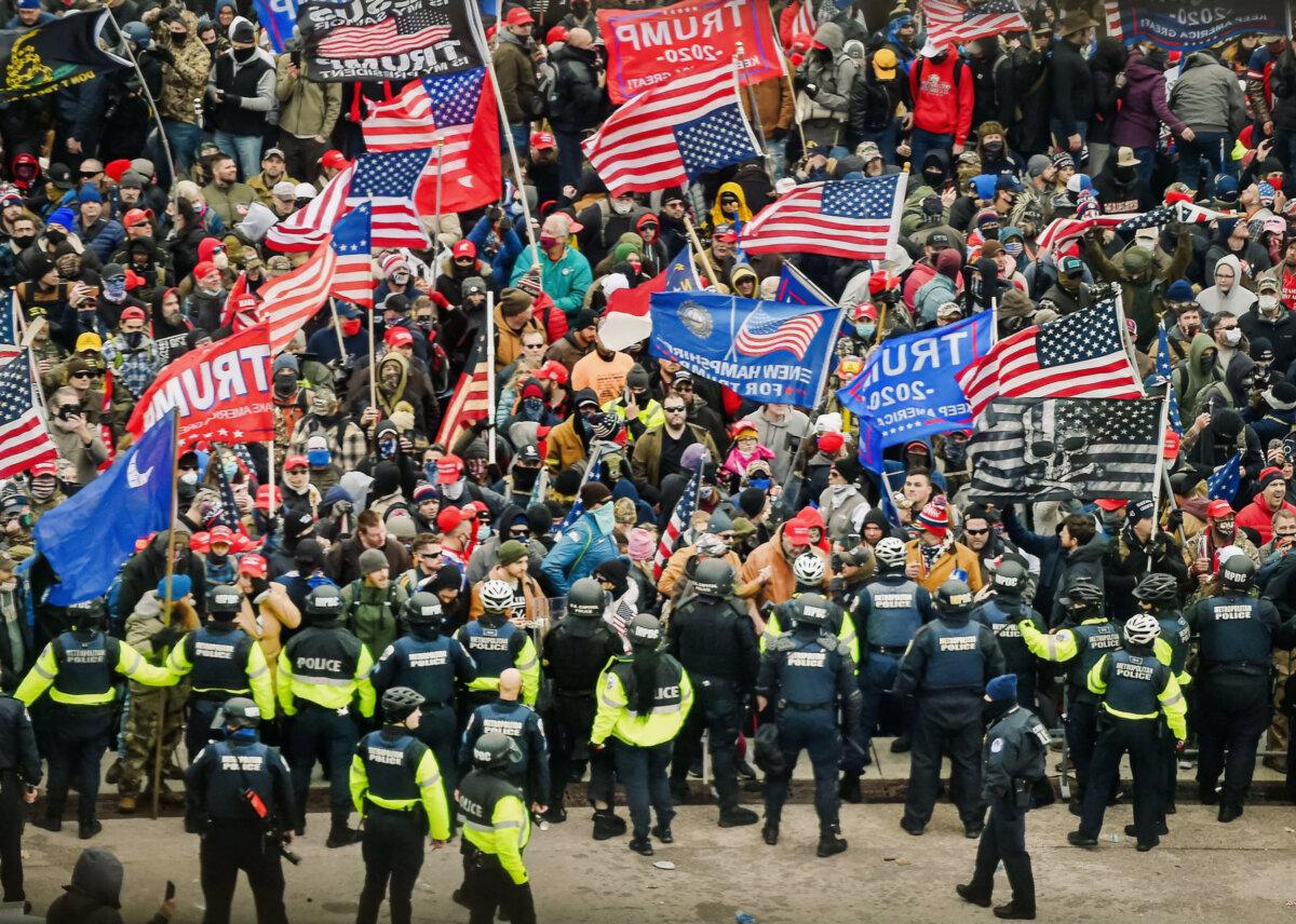 Demonstrators face off with police and security forces at the U.S. Capitol in Washington, on Jan. 6, 2021. (Olivier Douliery/AFP via Getty Images)