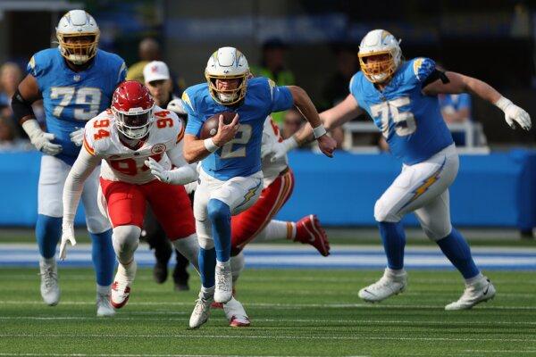 Easton Stick (2) of the Los Angeles Chargers runs the ball in the first half during a game against the Kansas City Chiefs in Inglewood, Calif., on Jan. 7, 2024 (Harry How/Getty Images)