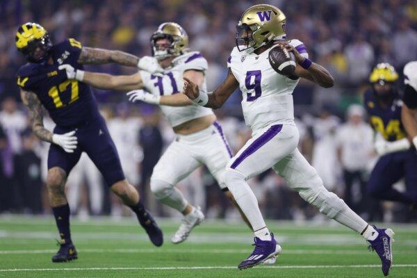 Michael Penix Jr. (9) of the Washington Huskies throws the ball in the first quarter against the Michigan Wolverines during the 2024 CFP National Championship game in Houston on Jan. 8, 2024. (Maddie Meyer/Getty Images)