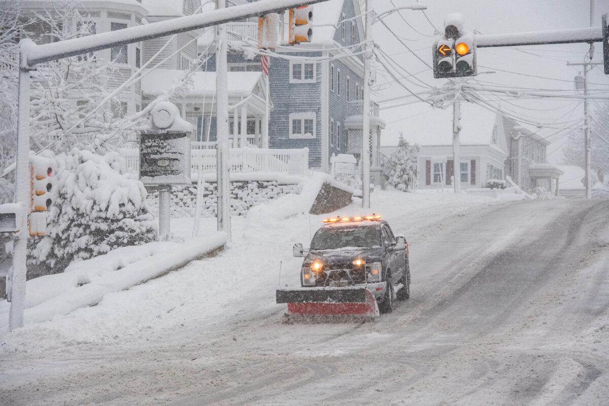 A snowplow clears snow from Broadway in Methuen, Mass., on Jan. 7, 2024. (Joseph Prezioso/AFP via Getty Images)