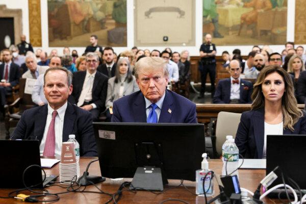 Former President Donald Trump sits with his attorneys during a civil fraud case brought by state Attorney General Letitia James, at a Manhattan courthouse in New York on Oct. 2, 2023. (Brendan Mcdermid/POOL/AFP via Getty Images)