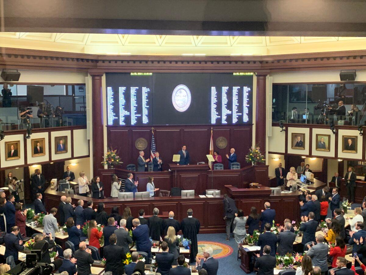 Florida Gov. Ron DeSantis gets a standing ovation during his 2024 State of the State Address to both houses of the Florida Legislature on Jan. 9, 2023 (T.J. Muscaro/The Epoch Times).