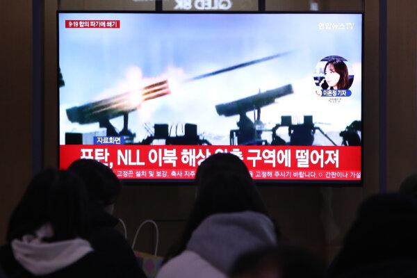 People watch a television screen showing a news broadcast with file footage of North Korea’s artillery firing, in Seoul, South Korea, on Jan. 6, 2024. (Chung Sung-Jun/Getty Images)