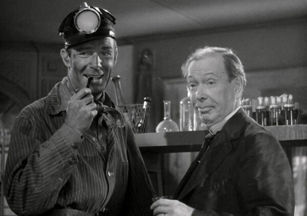 Cash Evans (Randolph Scott, L) enjoying a moment of levity with "Doc" Powers (Frank Craven), in “Pittsburgh.” (Universal Pictures)