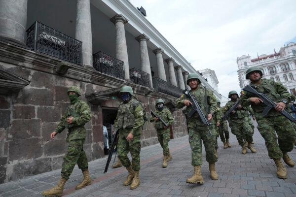 Soldiers patrol outside the government palace during a state of emergency in Quito, Ecuador, on Jan. 9, 2024. (Dolores Ochoa/AP Photo)