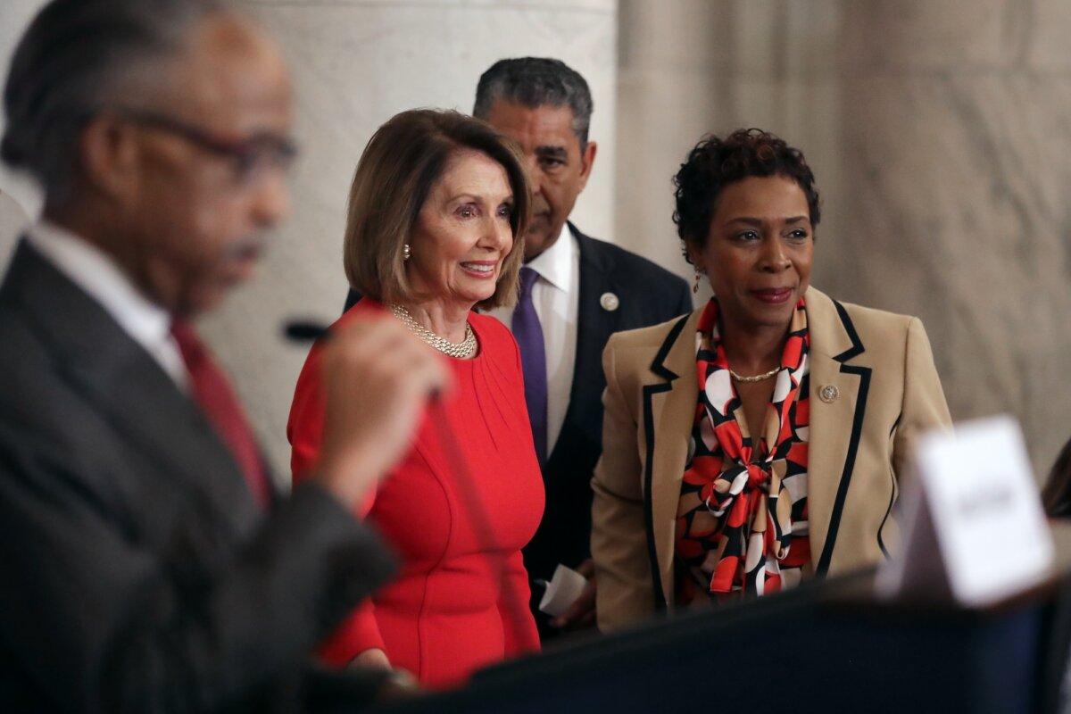 Then House Minority Leader Nancy Pelosi (D-Calif.), Rep. Adriano Espaillat (D-N.Y.), and Rep. Yvette Clarke (D-N.Y.) arrive for a meeting on Capitol Hill, in Washington, on Nov. 14, 2018. (Chip Somodevilla/Getty Images)