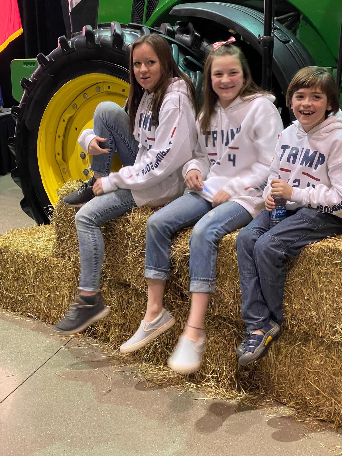 Three of the 12 Krachenfels children, from left: Alaycia, 16; Isabela, 13: and Asher, 10, pose at the Future Farmers of America Enrichment Center in Ankeny, Iowa, on Jan. 4, 2024. (Courtesy of Tim Krachenfels)