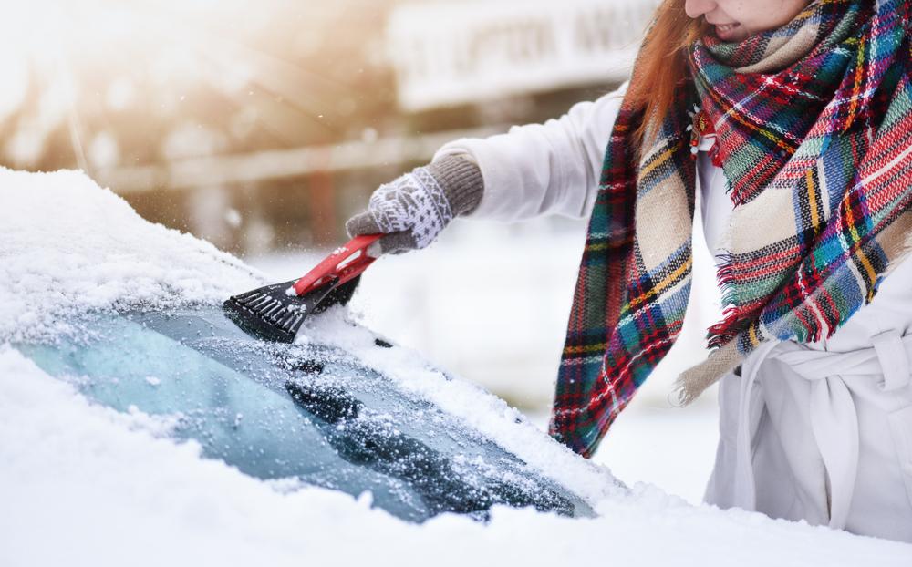 A windshield scraper, tire inflator, and shovel are just a few useful tools to keep in the vehicle in case of an emergency. (Krasula/Shutterstock)