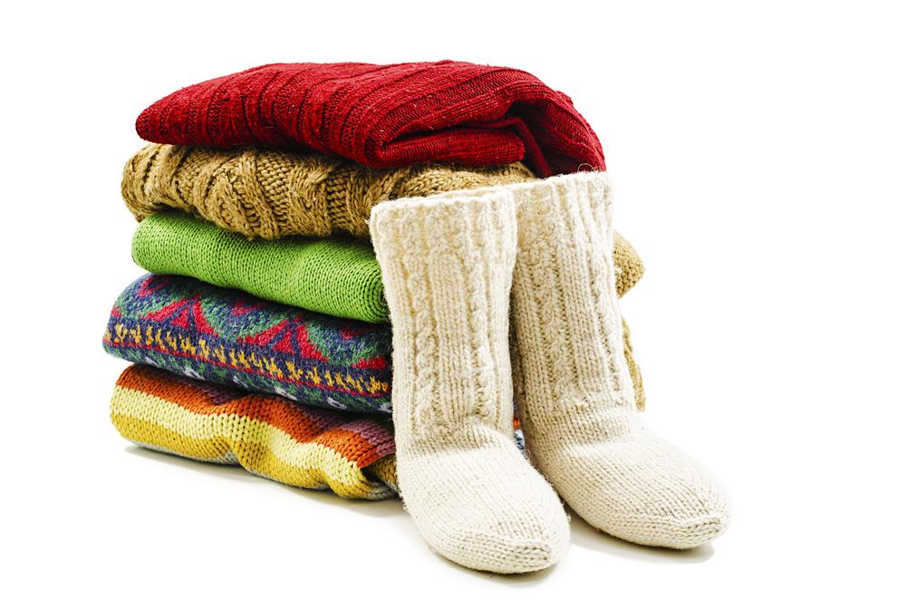 Wool blankets and clothing will prove essential in case the temperatures drop and the car battery dies. (Jeka/Shutterstock)