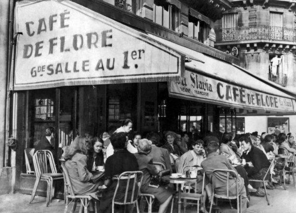 People have a drink on the terrace of the Café de Flore in the Saint-Germain-des-Prés district, in the 6th arrondissement of Paris, on June 15, 1949. (AFP via Getty Images)