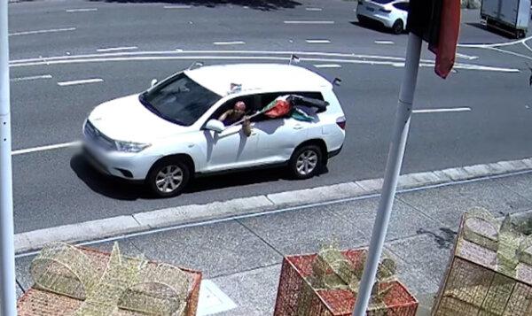 A white Toyota is seen carrying Palestinian flags outside the Woollahra Council in Sydney's east (Courtesy of NSW Police)