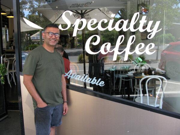 Zee Lalani, former owner of Charlie and Leo's Cafe in Lower Plenty, Melbourne, Australia poses for a photo at his shopfront on Dec. 24, 2023. (Henry Jom/The Epoch Times)