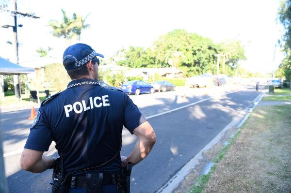 Police attend the scene of a multiple stabbing in Cairns, Australia, on Dec. 19, 2014. (Ian Hitchcock/Getty Images)