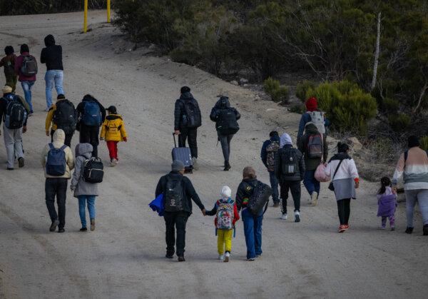 Border Patrol Morale Hits ‘All-Time Low’ 2 Illegal immigrants gather after crossing the United States border wall in Jacumba, Calif., on Jan. 10, 2024. (John Fredricks/The Epoch Times)