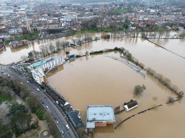A view of Worcestershire Cricket Ground-flooded by the river Severn following heavy rainfall in Worcester, England. (PA)