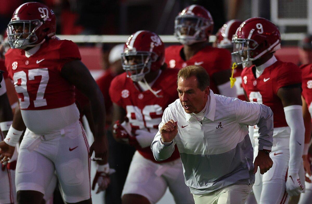 Head coach Nick Saban of the Alabama Crimson Tide runs the team out during pregame warmups prior to facing the LSU Tigers at Bryant-Denny Stadium in Tuscaloosa, Ala., on Nov. 4, 2023. (Kevin C. Cox/Getty Images)
