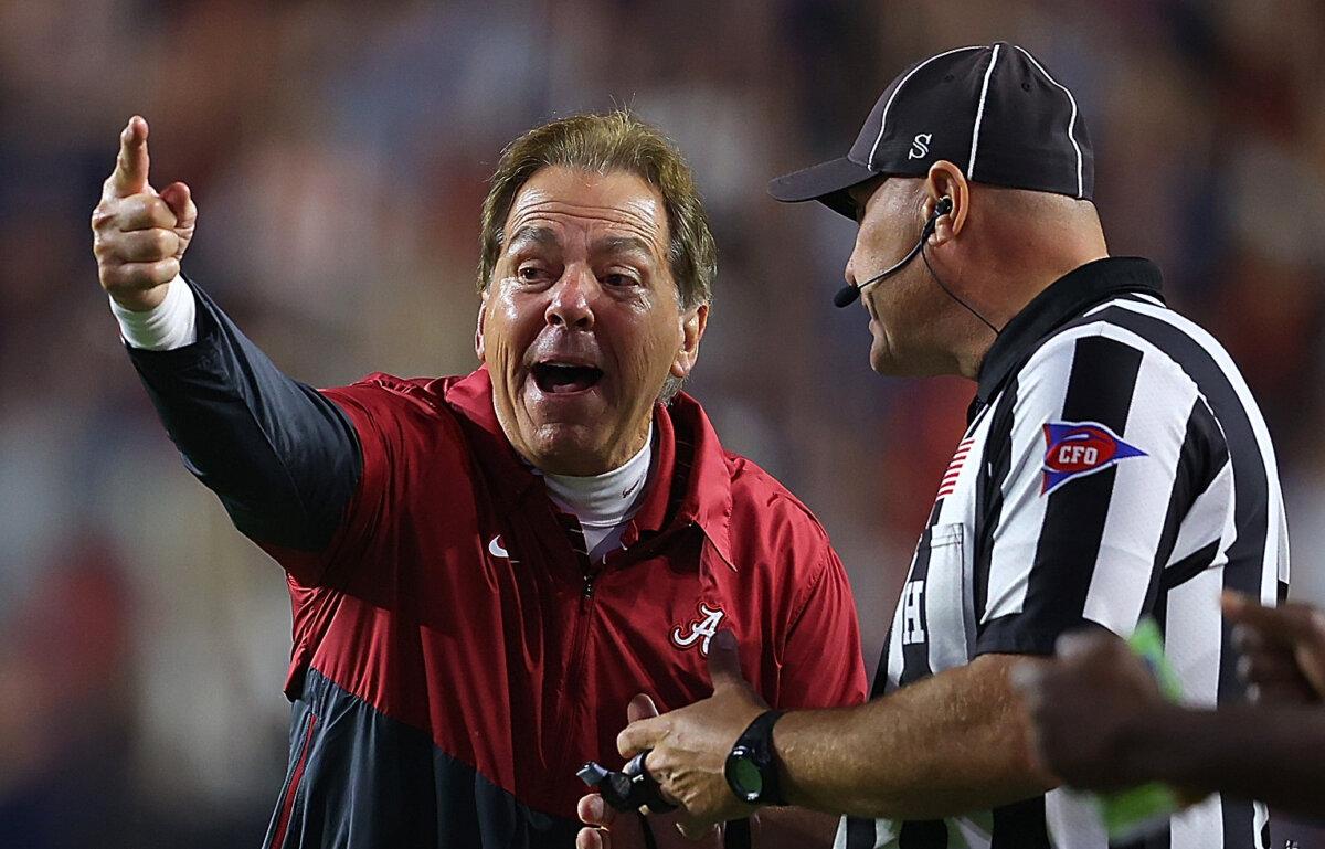 Head coach Nick Saban of the Alabama Crimson Tide reacts to head line judge Chad Green about a call during the fourth quarter against the Auburn Tigers at Jordan-Hare Stadium in Auburn, Ala., on Nov. 25, 2023. (Kevin C. Cox/Getty Images)