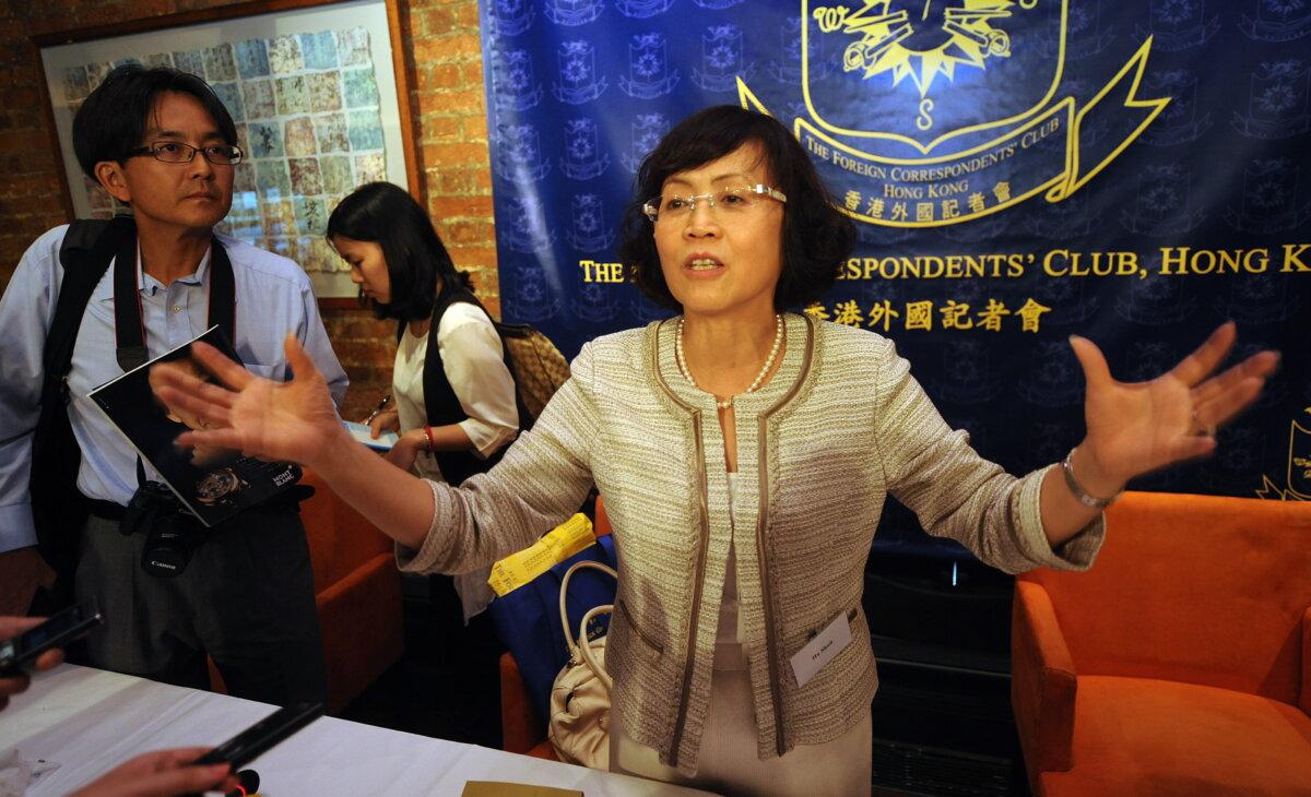 Hu Shuli, co-founder of China's independent Caixin Media, speaks at the foreign correspondents club in Hong Kong on July 11, 2011. (Mike Clarke/AFP via Getty Images)