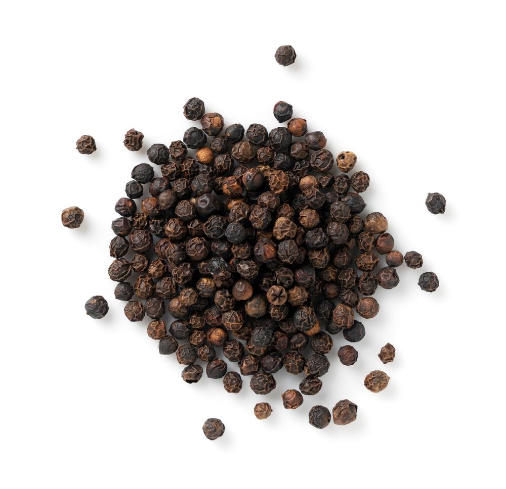 Black peppercorns are picked just before turning ripe, and turn dark when dried. (masa44/Shutterstock)