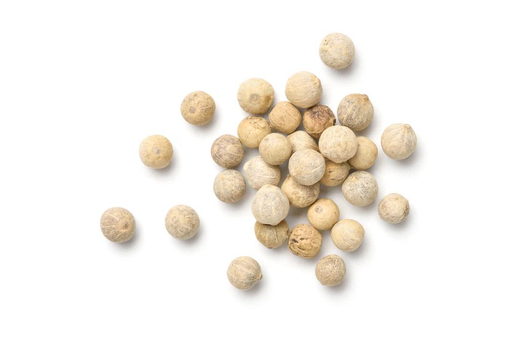 White peppercorns, which have a less biting flavor than black pepper, are picked slightly riper and soaked to remove their dark outer layers. (Photoongraphy/Shutterstock)